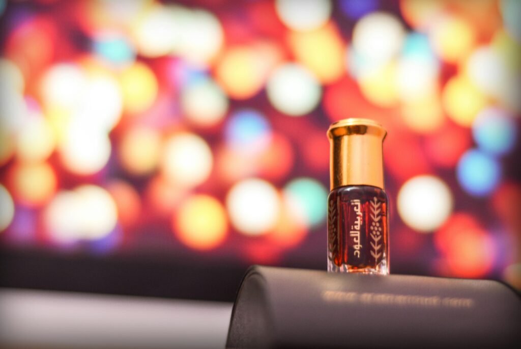 Elegant perfume bottle set against a vibrant, colorful bokeh background.
